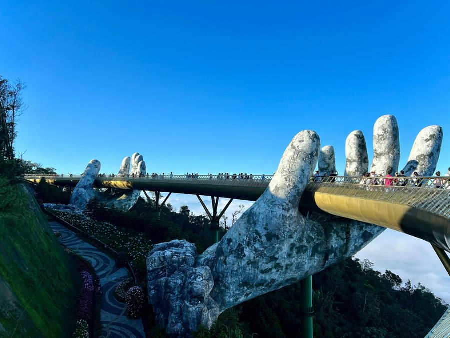 The Golden Bridge held by giant stone hands above Ba Na Hills, Da Nang